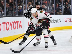 Chicago Blackhawks right wing Kris Versteeg will likely be out one month after blocking a shot with his hand Thursday. (USA Today)