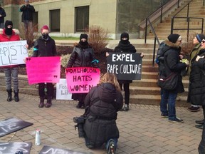 Protesters at Dalhousie University on Dec. 19 demand the dentistry students behind a Facebook group full of rape jokes be expelled from school. (Yalitsa Riden/Twitter)