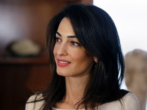 Human rights lawyer Amal Alamuddin Clooney is pictured before a meeting in the Greek Culture Ministry in Athens October 14, 2014. REUTERS/Thanasis Stavrakis