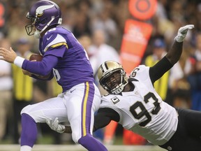 New Orleans Saints linebacker Junior Galette (93) reaches for Minnesota Vikings quarterback Matt Cassel at Mercedes-Benz Superdome in New Orleans, in this file photo taken September 21, 2014. (REUTERS/Crystal LoGiudice-USA TODAY Sports/Files)