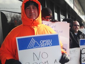 Jail guards picket Liberal MPP Jim Bradley's office in St. Catharines Monday. The guards are unhappy with contract negotiations between the Ontario Public Service Employees Union and the Ministry of Community Safety and Correctional Services.