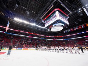 The USA flag is raised to the rafters after Team USA defeated Team Germany during the 2015 IIHF World Junior Championship game at the Bell Centre on December 28, 2014. (JOHANY JUTRAS/LE JOURNAL DE MONTRÉAL/QMI AGENCY)