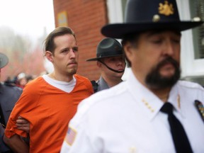 Eric Matthew Frein exits the Pike County Courthouse with police officers after an arraignment in Milford, Pa., Oct. 31, 2014. (MARK MAKELA/Reuters)