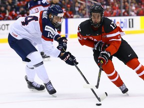 Connor McDavid of Canada skates around Erik Cernak of Slovakia during the semifinals of 2015 World Junior Championship at the Air Canada Centre in Toronto Sunday January 4, 2015. (Dave Abel/Toronto Sun/QMI Agency)