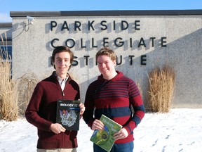 Parkside Collegiate Institute students Jason Kerkvliet, left, and Daniel Pfingstgraef clutch science textbooks outside the school on Monday. The two have organized Healthcare Career Day, a chance for elementary and high school students to interact with health care workers in a bid to inspire them and clear up misconceptions about the health care field. (Ben Forrest/Times-Journal)