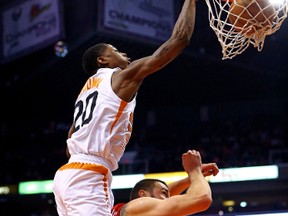 Suns guard Archie Goodwin throws down a dunk over Raptors’ Jonas Valanciunas on Sunday. (USA TODAY)