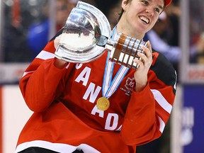 Connor McDavid raises the trophy as Team Canada celebrates its win over Team Russia during the gold medal game of 2015 World Junior Hockey Championships at the Air Canada Centre on January 5, 2015. (Dave Abel/Toronto Sun/QMI Agency)