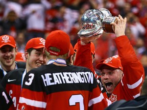 Max Domi raises the trophy as Team Canada celebrates the 2015 World Junior Hockey Championships gold medal win over Russia at the Air Canada Centre on January 5, 2015. (Dave Abel/Toronto Sun/QMI Agency)