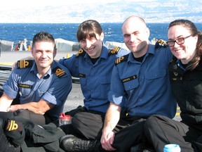 Navy Lieut. Nadia Shields, second from left, sits with fellow Royal Canadian Navy officers on the flight deck of HMCS Toronto while deployed last month on Operation Reassurance in the Mediterranean Sea. 
Contributed/Chief Petty Officer (first class) Ian McNaughton