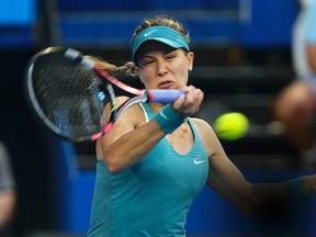 Eugenie Bouchard plays a shot to Serena Williams during their women's singles match at the Hopman Cup in Perth, Australia, on Tuesday, Jan. 6, 2015. (Reuters)