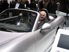 Writer Jim Fox checks out a Porsche Boxster convertible at the auto show Charity Preview in Detroit. (Barbara Fox/Special to QMI Agency)
