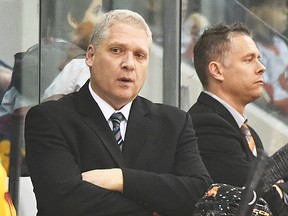 Belleville Bulls GM-coach George Burnett and assistant Jake Grimes on the bench. (Aaron Bell/OHL Images)