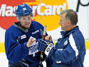 Phil Kessel talks to former coach Ron Wilson during an October 2011 Leafs practice. (Toronto Sun files)