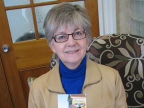 Lynda Packer is holding a photo of her parents Clara and Jim Aspden in the offices of the Alzheimer Society of Oxford. Packer shared the story of her mother's journey with Alzheimer's disease as part of Alzheimer Awareness Month. (HEATHER RIVERS/WOODSTOCK SENTINEL-REVIEW)