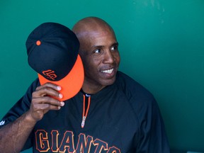 Former San Francisco Giants outfielder Barry Bonds sits in the dugout prior to a game against the Chicago Cubs at Scottsdale Stadium. (Mark J. Rebilas/USA TODAY Sports)