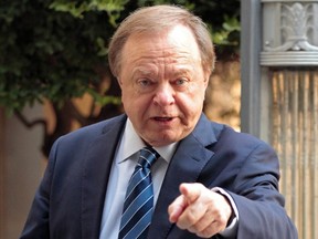 Harold Hamm, founder and CEO of Continental Resources, enters the courthouse for divorce proceedings with then wife Sue Ann Hamm in Oklahoma City, Oklahoma, in this September 22, 2014 file photo. (REUTERS/Steve Sisney/Files)