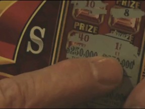 John Wines shows a KOB Eyewitness News 4 reporter a scratch-off instant lottery ticket that he thought had the winning numbers. (KOB screengrab)