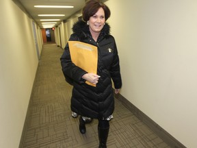 Theresa Oswald files new membership submissions at the NDP headquarters in Winnipeg Tuesday, Jan. 6, 2015.