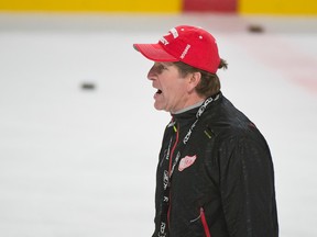 Mike Babcock shouts instructions during a Red Wings practice in Montreal earlier this season. (QMI Agency)
