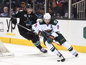 Minnesota Wild winger Zach Parise (11) controls the puck against San Jose Sharks defenceman Mirco Mueller (41) during NHL play at SAP Center in San Jose. (Kyle Terada/USA TODAY Sports)