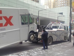 Toronto Police Traffic Services Const. Clint Stibbe tweeted this photo Tuesday, Jan. 6, 2014, of a FedEx truck being towed during the rush-hour traffic blitz. (@TrafficServices)