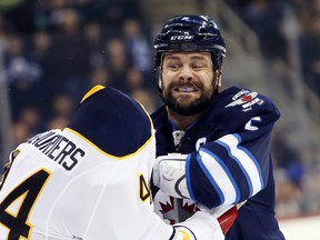 Mark Stuart was injured in a fight against Nicolas Deslauriers of the Buffalo Sabres.