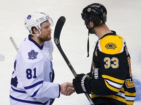 Maple Leafs' Phil Kessel (left) shakes hands with Boston Bruins' Zdeno Chara after the Bruins defeated the Leafs in overtime in Game 7 of their NHL Eastern Conference quarter-final hockey playoff series in Boston (REUTERS/Brian Snyder)