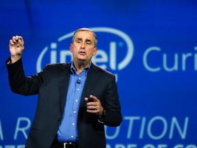 Brian Krzanich, CEO of Intel, holds the button-sized Intel Curie module, at the International Consumer Electronics show (CES) in Las Vegas, Nevada Jan.6, 2015.  The device is expected to be available later this year.      REUTERS/Rick Wilking