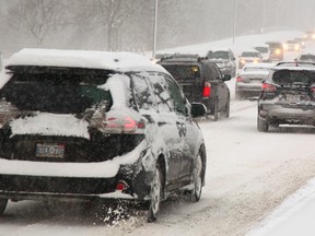 Traffic on Wonderland Road just north of the Guy Lombardo bridge was heavy but moving well in the snow in London, Ont. on Wednesday January 7, 2015. 
Mike Hensen/The London Free Press/QMI Agency