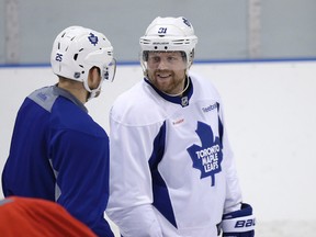 Leafs' Phil Kessel (R) talks with Mike Santorelli as the Maple Leafs practised at the Mastercard Centre in Toronto on Tuesday January 6, 2015. (Craig Robertson/Toronto Sun)