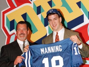 Colts owner Jim Irsay (left) poses with Peyton Manning after Manning was selected the top pick overall in the 1998 draft. Manning played 14 seasons for the Colts before he was released in 2012. (Reuters)