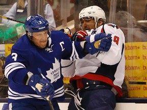 Maple Leafs captain Dion Phaneuf rubs out Capitals’ Alex Ovechkin at the ACC last night. (Jack Boland/Toronto Sun)