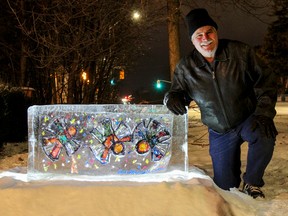 Local artist David Dossett beside his three angels frozen art exhibit outside his home on King Street. His pilot project, Froid'Art Exhibition, will see eight to 10 local artists work displayed in lit frozen blocks of ice on private property in downtown Kingston this winter. (Julia McKay/The Whig-Standard)