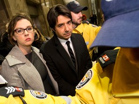 Jian Ghomeshi leaves College Park courts with his lawyers on Thursday, Jan. 8, 2015. (CRAIG ROBERTSON/Toronto Sun)