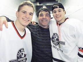 J.P. Parise (centre), seen here with his sons Jordan (left) and Zach (right) in 2001, passed away from lung cancer on Wednesday night.  (QMI Agency/Files)