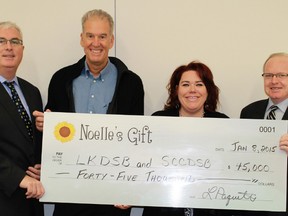 Noelle's Gift presented a $45,000 donation to St. Clair Catholic and Lambton Kent School Boards at the LKDSB Education Centre on Thursday. The funds will be available to purchase items for students in need across both school boards. From left to right: LKDSB's Jim Costello, Noelle's Gift's Kevin Cannon and Jackie Major-Daamen and SCCDSB's Dan Parr. 
CARL HNATYSHYN/ QMI AGENCY