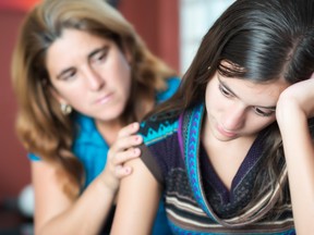 Mother consoling daughter. 

(Fotolia)