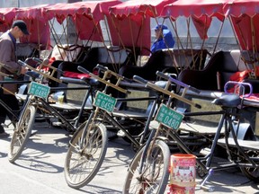 Pedicab operators await customers in Beijing's traditional Shichahai area. Rides cost about $4-$6 but be prepared to haggle. IAN ROBERTSON PHOTO
