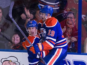 Jordan Eberle celebrates one of his two goals against the Red Wings Tuesday with teammate Justin Schultz. (David Bloom, Edmonton Sun)