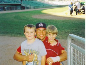 Russell Martin poses with Logan White (right) from a 2009 photo. White made sure to wear Martin's No. 55 on his baseball uniform until he adopted his good friend Christina Taylor Green's No. 12, which he wears to this day playing high school baseball. (QMI AGENCY/FILES)