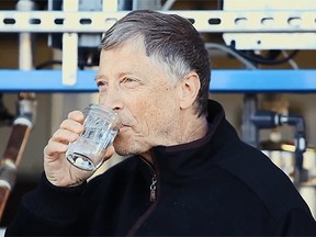 Bill Gates drinks a glass of water, which had been produced from human feces, in this screenshot from YouTube. (thegatesnotes/YouTube)