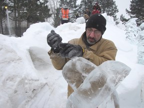 Jeffrey Rafuse, of Corunna, is pictured working on a series of ice sculptures for Snowfest back in 2011. Sarnia's long-standing annual Snowfest celebration has been put on a hiatus this year as its board goes through a period of transition. FILE PHOTO