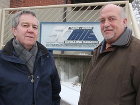 Michael Bosher, president of BKL Engineering, and Marty Raaymakers, president of MIG Engineering, pose for a photo outside the current MIG office in Sarnia where the two companies will join together when they merge in March. Between them, the two firms claim a stake in helping build more than 80% of Sarnia-Lambton's public infrastructure. TYLER KULA/ THE OBSERVER/ QMI AGENCY