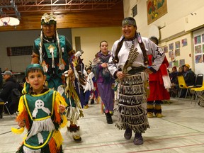 Cameron Cochrane dances with his grandparents Holly Rodrique and George Rose Paul Martin during the Children’s New Year’s Eve Mini Pow Wow held at Inahepanik Community Centre. For the third consecutive year, area First nations people gathered in Cochrane to toast in the New Year.