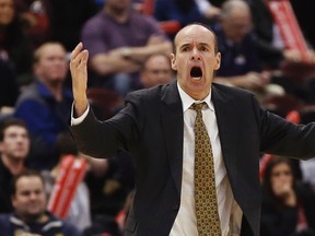 Carleton University Ravens head coach Dave Smart reacts during their Canadian Interuniversity Sport semi-final basketball game against the University of Alberta Golden Bears in Ottawa March 8, 2014. REUTERS/Chris Wattie