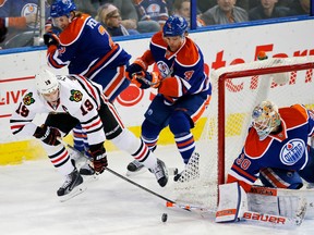 Chicago Blackhawks forward Jonathan Toews is stopped by Edmonton Oilers goaltender Ben Scrivens. Perry Nelson/USA Today