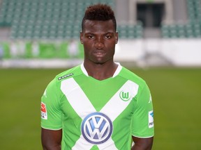 A picture taken on July 30, 2014 shows Wolfsburg's Belgian midfielder Junior Malanda posing for a photograph during the official presentation of German first division Bundesliga football team VfL Wolfsburg in Wolfsburg, central Germany. (AFP PHOTO)