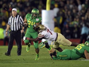 Florida State Seminoles linebacker Matthew Thomas (7) attempts to tackle Oregon Ducks running back Thomas Tyner (24) in the 2015 Rose Bowl college football game at Rose Bowl. Kirby Lee-USA TODAY Sports