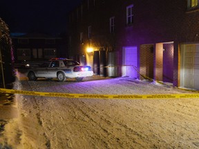 Police closed off the perimeter where a shooting occurred on Doane St. in the west end on Saturday, January 10, 2015. It's the first shooting of 2015 after a record numbrer in 2014. 
Matthew Usherwood/Ottawa Sun