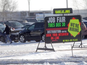 Outside of the distribution centre, a large sign advertises a Dec. 30 job fair for the company -- but it seemed only temporary workers need apply.